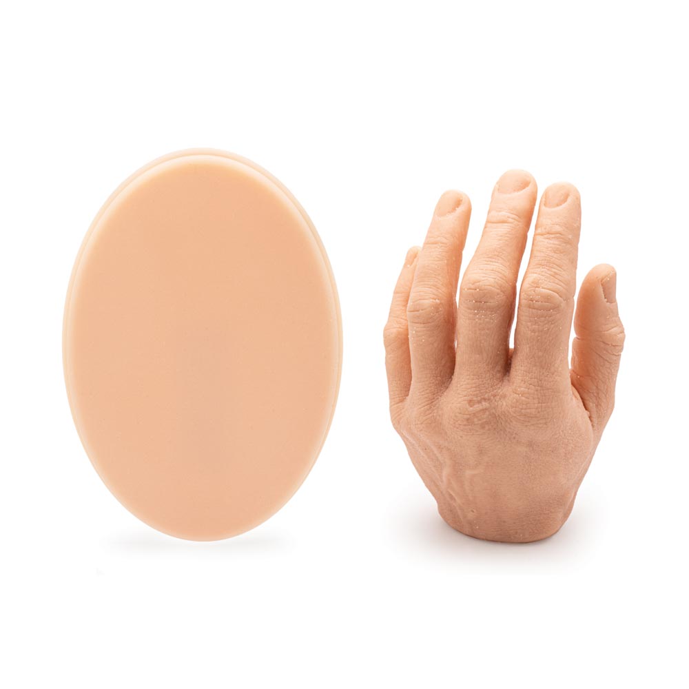 A Pound of Flesh Micro Series Tattooable Synthetic Small Oval (with hand for scale)