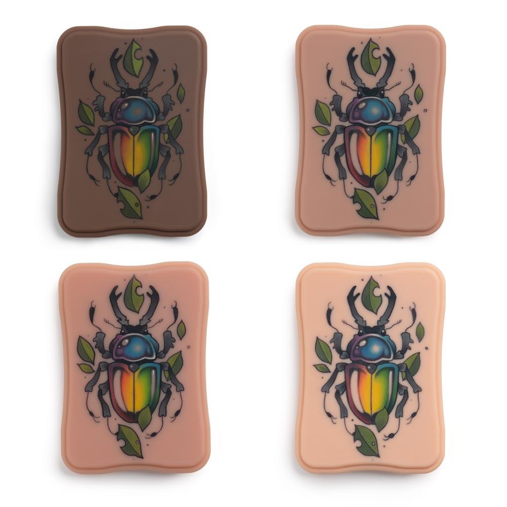 A Pound of Flesh Micro Series Tattooable Synthetic Small Oval in all tones with example tattoo shown